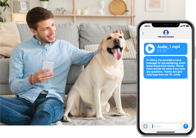 man seated on floor, petting dog while holding smartphone displaying SMS message